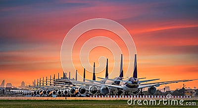 Commercial airplane parking at the airport are stopped effect by covid-19 pandemic around the world economic down crisis, Stock Photo