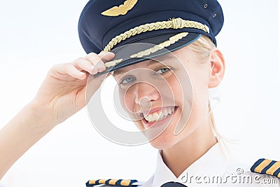 Commercial captain pilot in uniform smiling. Aviation Stock Photo
