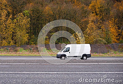 Commercial cargo and small business mini van going on the road w Stock Photo