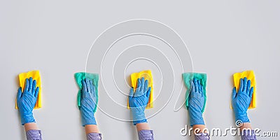 Commercial cleaning company. Employee hands in blue rubber protective glove. General or regular cleanup Stock Photo