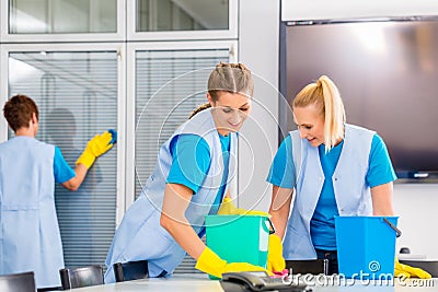 Cleaning brigade working in office Stock Photo