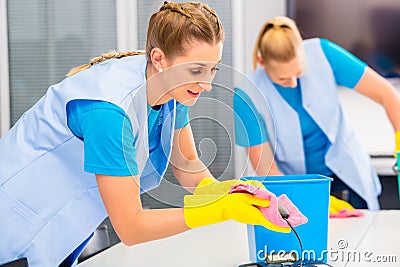 Cleaning ladies working in office Stock Photo