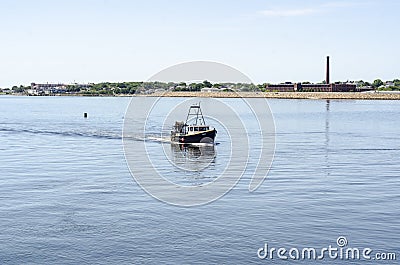 Commercial fishing vessel Pedlar crossing New Bedford outer harbor Editorial Stock Photo