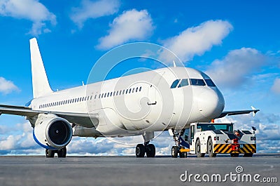 Commercial passenger airplane during push back operation. Stock Photo