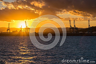 Commercial port of Barcelona and the city center during sunset Editorial Stock Photo