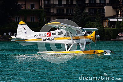 Commercial seaplane at lake. Small and sport aircraft. General aviation industry. Vip transport. Civil utility transportation. Editorial Stock Photo