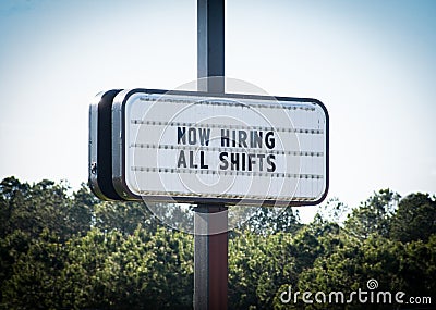 `NOW HIRING, ALL SHIFTS` Sign Stock Photo