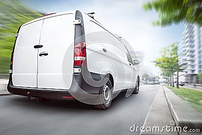 Commercial van driving in the city Stock Photo