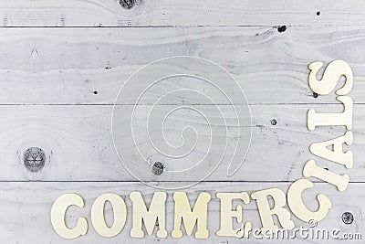 Commercials concept forming corner border on light grey wood Stock Photo