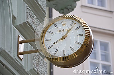 Commercials wall clock Rolex that reads the correct time Editorial Stock Photo