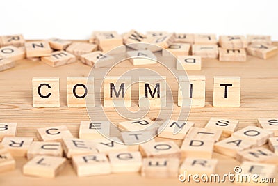 Commit,word written on wood cube Stock Photo