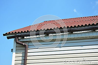 Common Gutter Problems. Bad Gutter. House Construction with roofing and rain gutter system as bad building example. Stock Photo