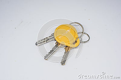 Three door keys and a yellow access card Stock Photo