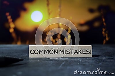 Common Mistakes! on the sticky notes with bokeh background Stock Photo