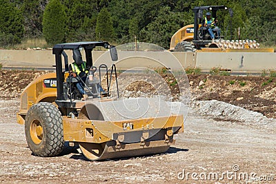 Common road building equipment the caterpillar CS56B Editorial Stock Photo