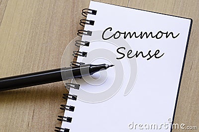 Common sense write on notebook Stock Photo