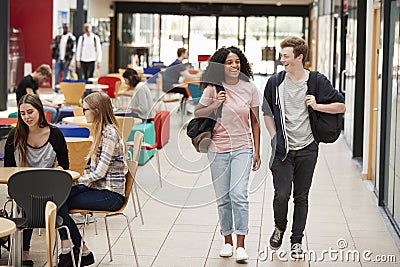 Communal Area Of Busy College Campus With Students Stock Photo