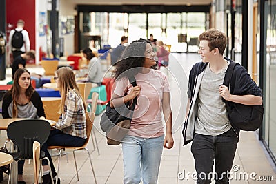 Communal Area Of Busy College Campus With Students Stock Photo