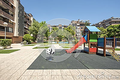 Communal recreational area for children, swings, slides and swimming pool in the center Stock Photo