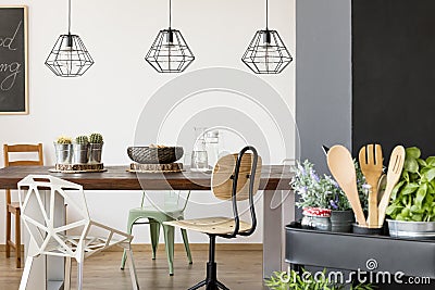 Communal table and pendant lamps Stock Photo