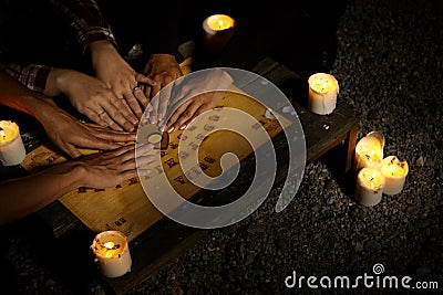 Communicating with ghosts through spiritual board Stock Photo