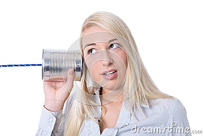 Communication or advertising concept: young isolated woman calling with tin can. Stock Photo