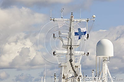Communication antennas and finnish flag on a cruise vessel Stock Photo