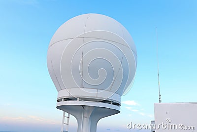 Communication equipment on a cruise ship under clear blue skies Stock Photo