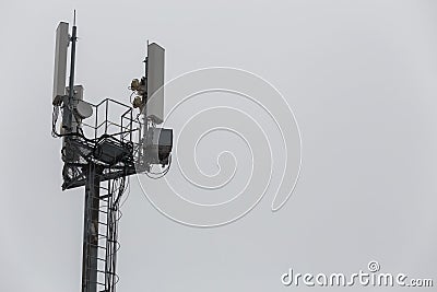 communication and gsm, wcdma, hspda and other 3g, 4g standarts tower close-up in cloudy weather Stock Photo