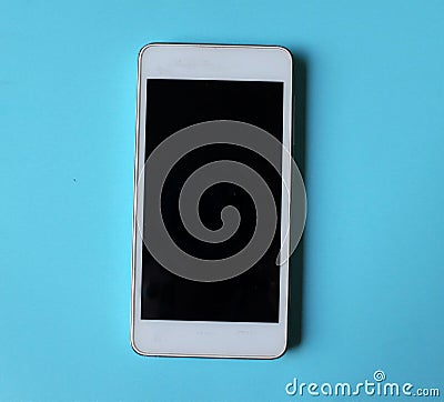 Smartphone top view on a blue background. Stock Photo