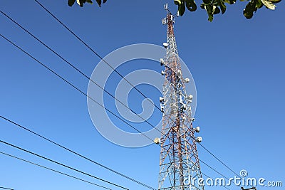 Communication tower. Telco Trellis for 3G 4G 5G Apocalypse Internet Communication, mobile, FM Radio and Television Broadcasting On Stock Photo