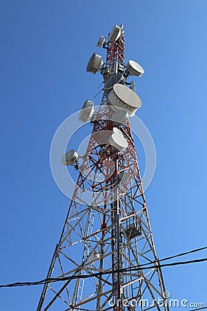 Communication tower. Telco Trellis for 3G 4G 5G Apocalypse Internet Communication, mobile, FM Radio and Television Broadcasting On Stock Photo