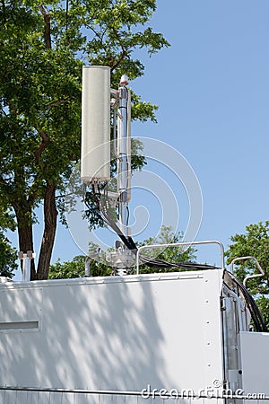 Communication Tower telephone relay antenna station cellular in city building Stock Photo