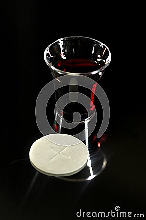 Communion Cup with Wine and Wafer Stock Photo