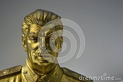 Communist artefacts - Gold Stalin statue - Museum Prague Editorial Stock Photo