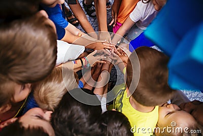 Community of children holding hands together closeup in the Kindergarten Editorial Stock Photo