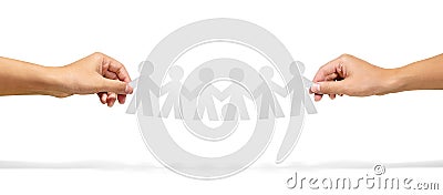 Community, unity and teamwork concept - hands holding paper chain people over white background Stock Photo