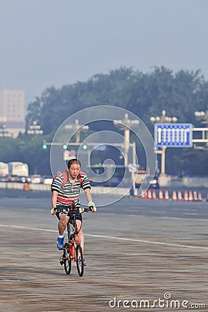 Commuter on a bike in the early morning, Beijing, China. Editorial Stock Photo