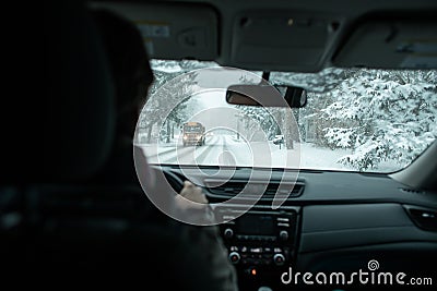 A commuter driving in a winter snow storm Stock Photo