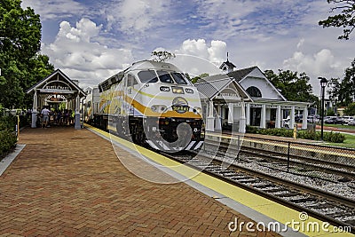 Commuter rail service for Winter Park , Florida . Train station for a mid morning commute for points north and south Editorial Stock Photo