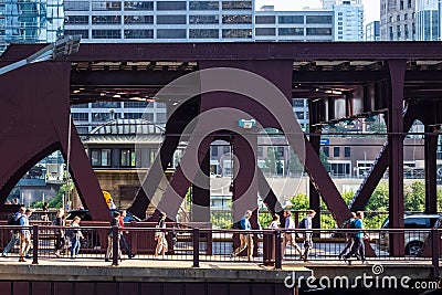 Commuters and cars hurry along the Lake Street bridge during July summer rush hour Editorial Stock Photo