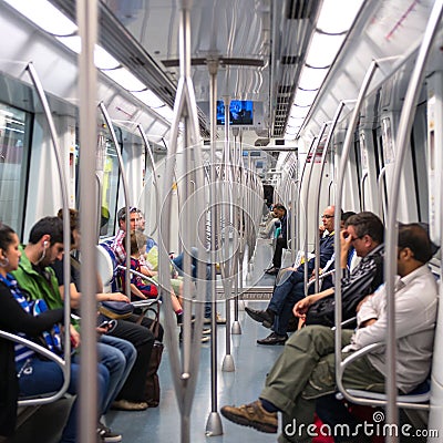 Commuters in subway wagon. Editorial Stock Photo