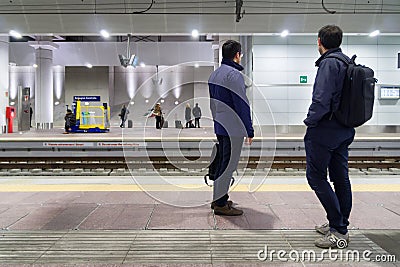 Commuters waiting high speed trains Editorial Stock Photo