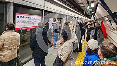 Commuters waiting in line for the metro train Editorial Stock Photo