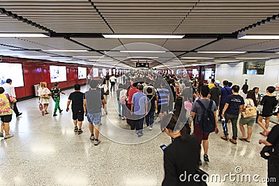 Commuters waiting for a train in the MTR Wan Chai in Hong KongCommuters waiting for a train in the MTR Wan Chai in Hong Kong Editorial Stock Photo