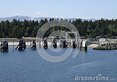 Comox Ferry dock at the shore in Little River, Vancouver Island Stock Photo