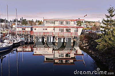 Comox Harbour office and its reflection. Editorial Stock Photo