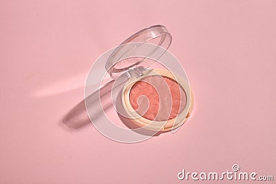 A compact blusher on pink background Stock Photo