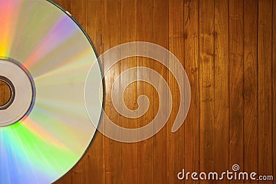 Compact disc on a Wooden Background Stock Photo