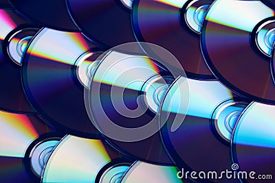 Compact discs background. Several cd dvd blu-ray discs. Optical recordable or rewritable digital data storage. Stock Photo